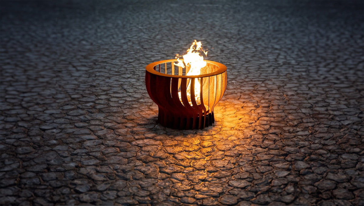 The Neutron 36 inch stainless steel fire sculpture on a patio – lifestyle