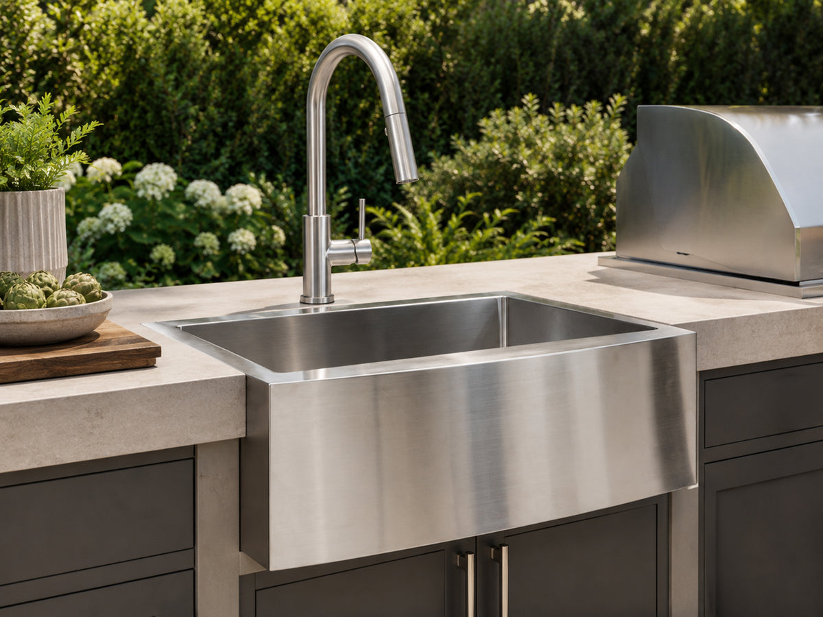 Cameo stainless steel farmhouse sink and pull-down faucet in an outdoor kitchen