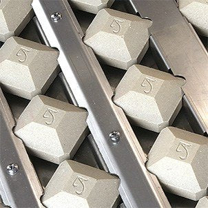 American Eagle 36" grill detail: ceramic briquettes over the stainless U-burners