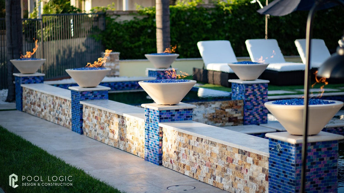 Cazo fire bowl in vanilla finish on a patio
