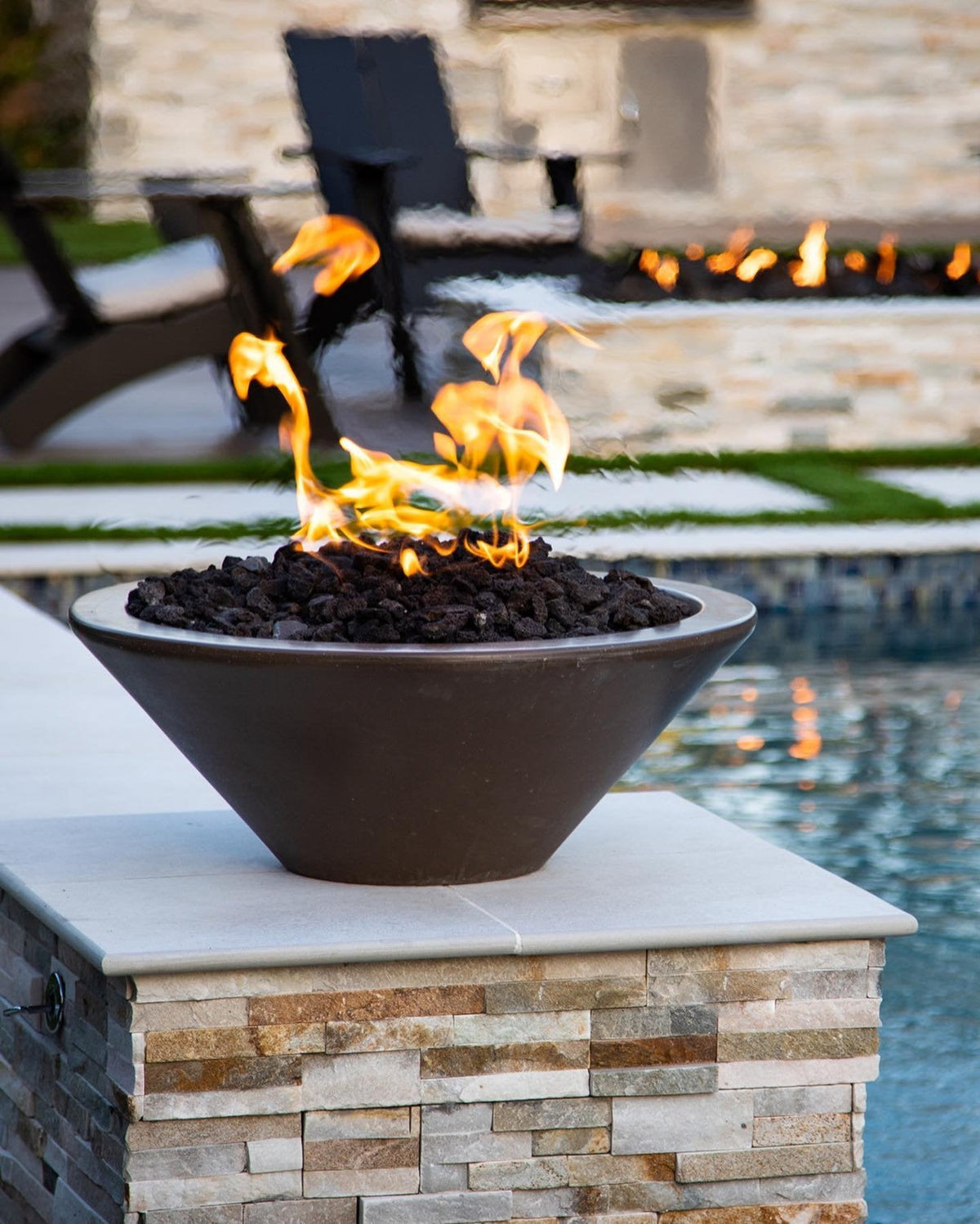 Cazo fire bowl beside a modern pool
