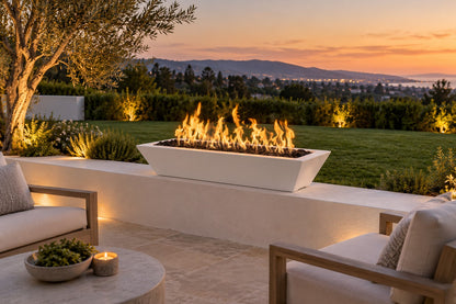 48" x 20" Linear Maya Fire Bowl - Powder Coat by The Outdoor Plus, white finish on a terrace seat wall