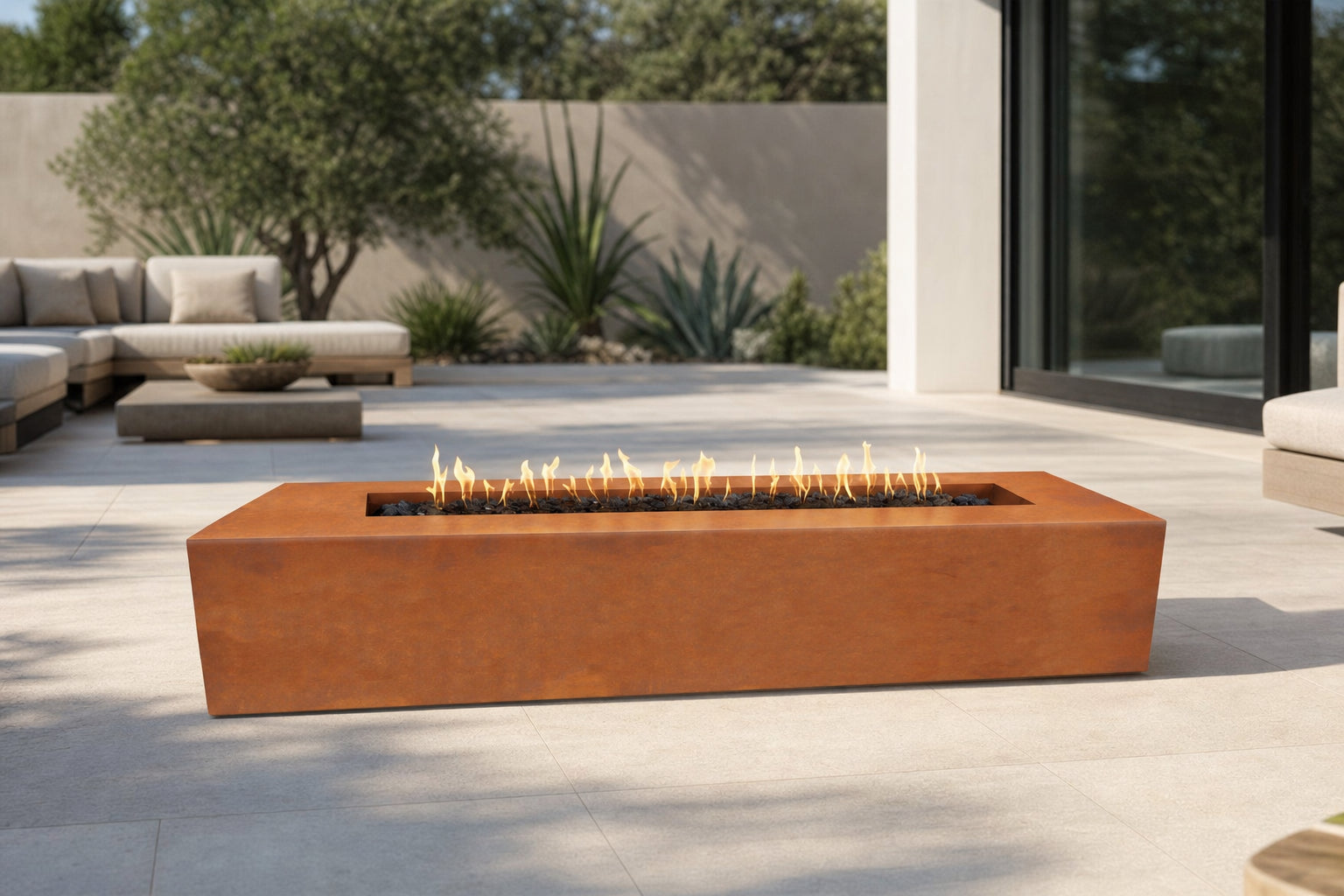 The Outdoor Plus Regal 54-inch gas fire pit in Corten steel on a modern patio