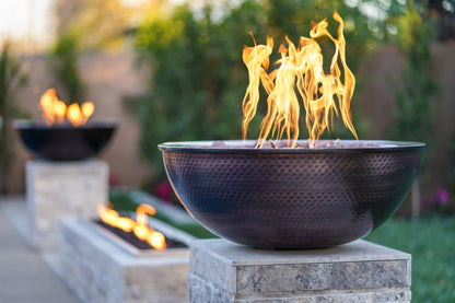 Sedona copper fire bowl glowing at dusk