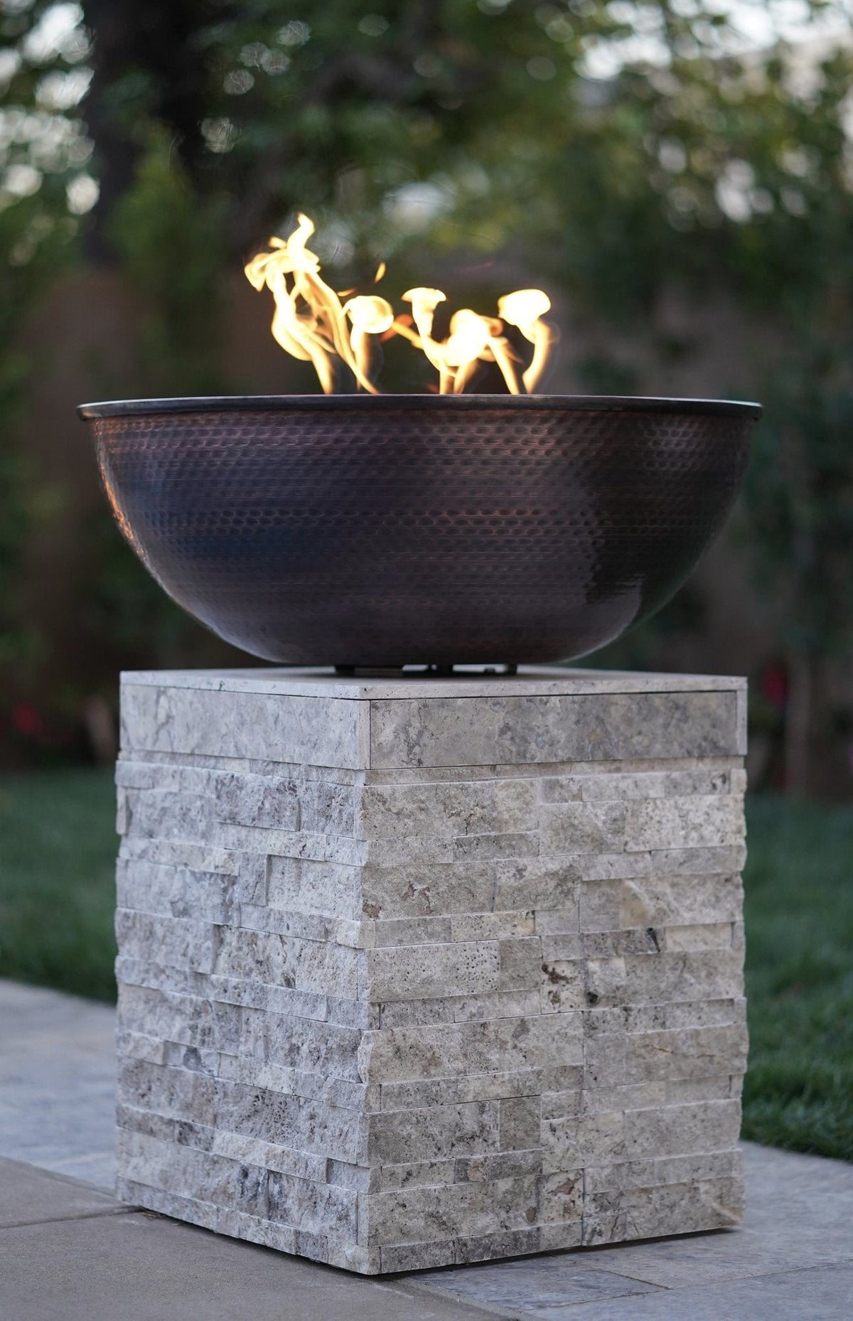 Sedona copper fire bowl on an outdoor terrace