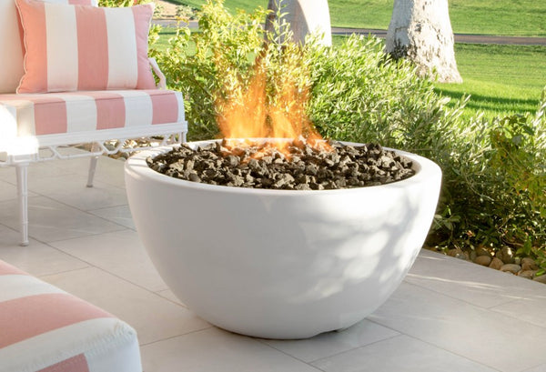 White GFRC concrete gas fire bowl on a patio