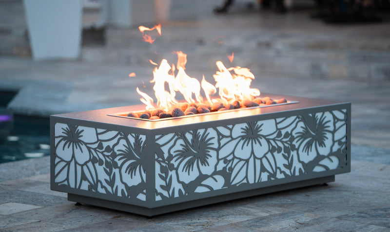 Rectangular gas fire pit with a laser-cut hibiscus pattern metal base