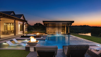 Maya GFRC fire bowl in vanilla finish on a patio