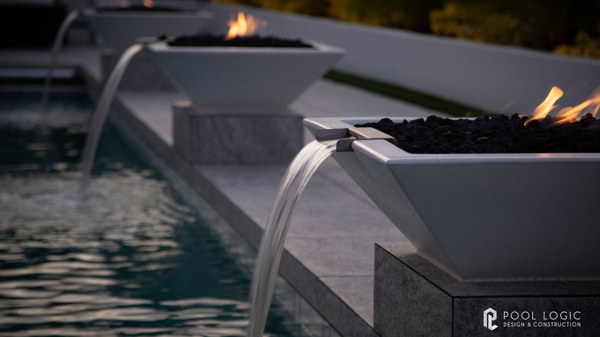 Maya fire and water bowl in limestone finish poolside